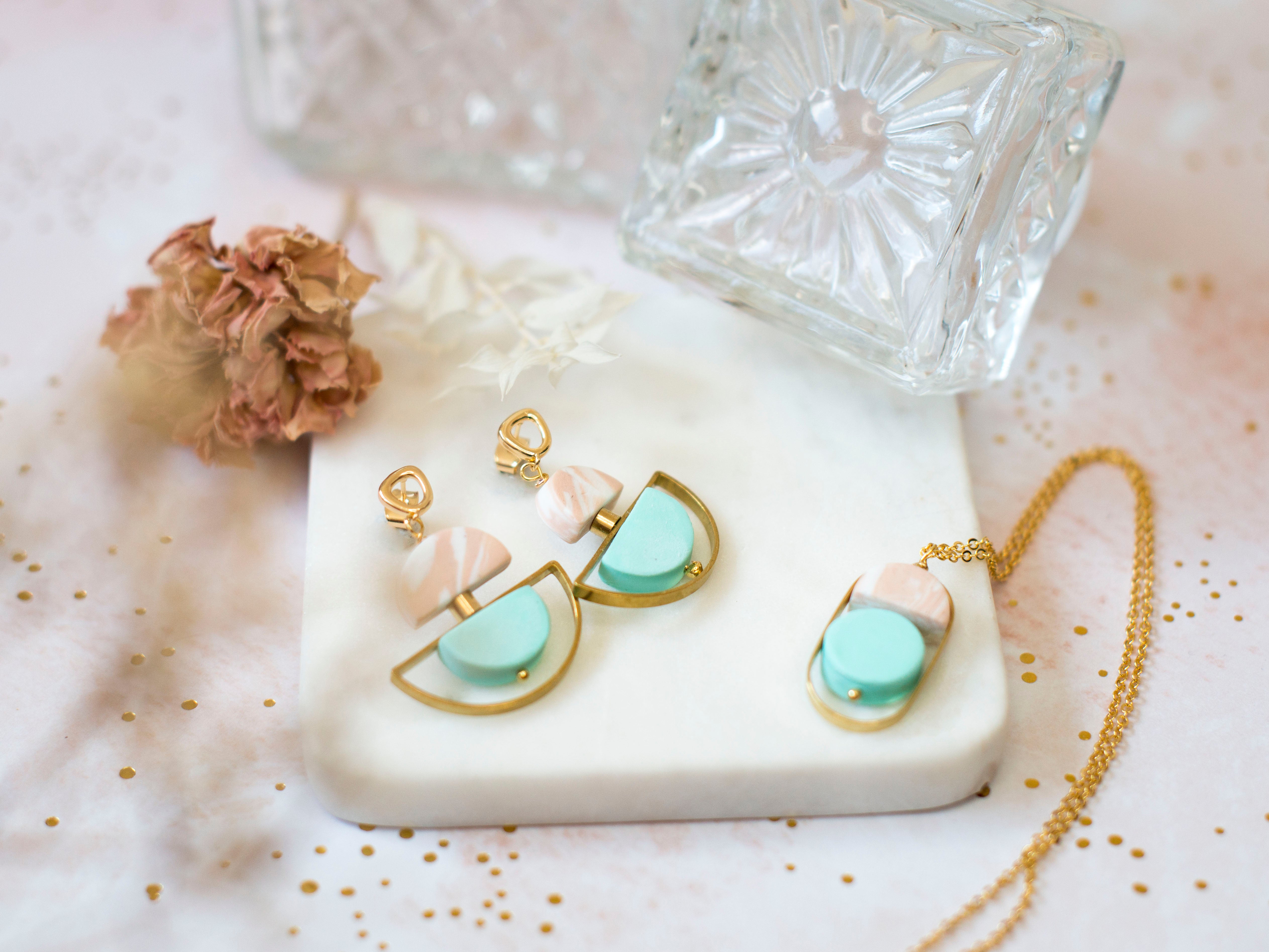 pastel art deco earrings in raw brass and gold plated brass